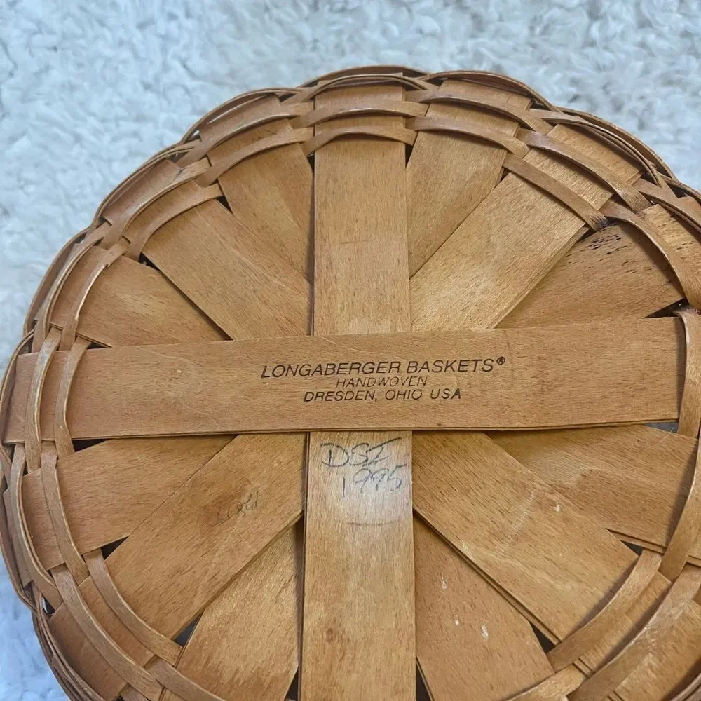 Longaberger 1995 set of two Handcrafted round and Square Woven baskets .
